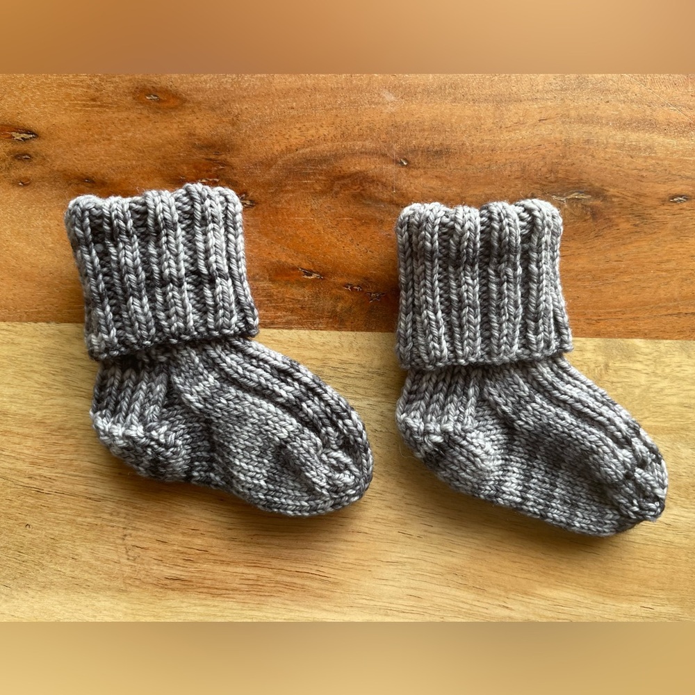 Last chance! 
Hand Knit Baby Socks—that will actually stay on your baby’s feet!